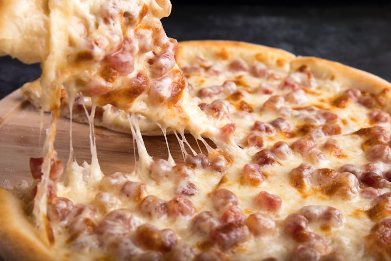 Marcos BBQ Chicken pizza with smoky sauce and red onions