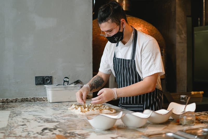 Marcos restaurant kitchen crafting marco's pizza from fresh dough